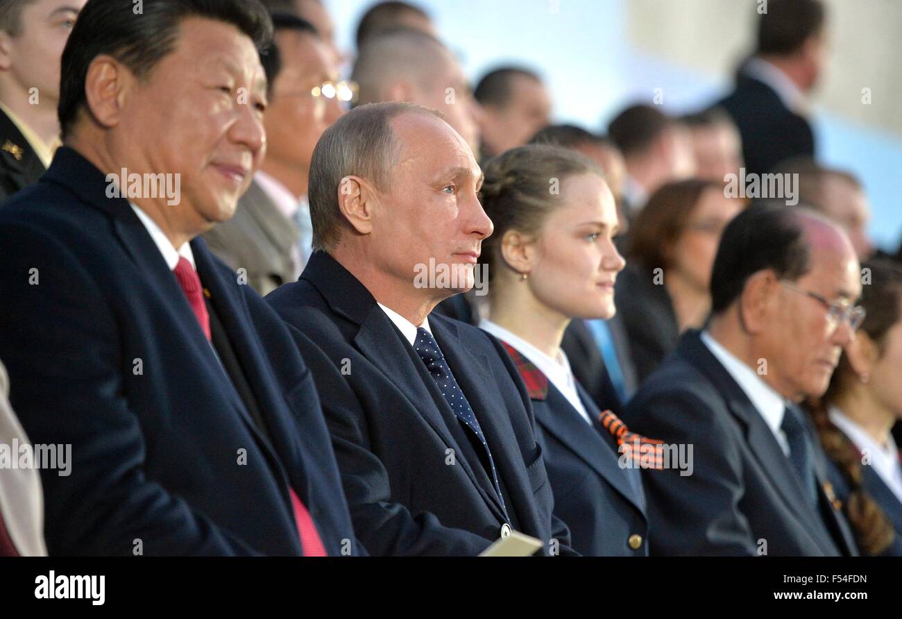 Russian President Vladimir Putin sits with Chinese President  Xi Jinping during a gala celebrating the 70th anniversary of World War II in Red Square May 9, 2015 in Moscow, Russia. Stock Photo