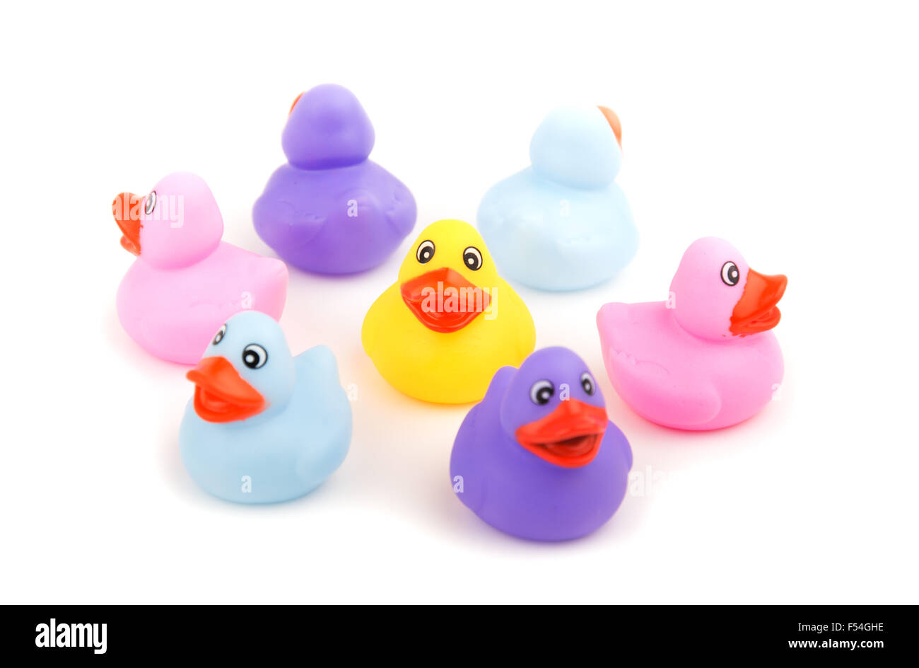 Rubber ducks with their backs turned to one in the middle - concept of shunning or avoiding, focus on the yellow duckling Stock Photo