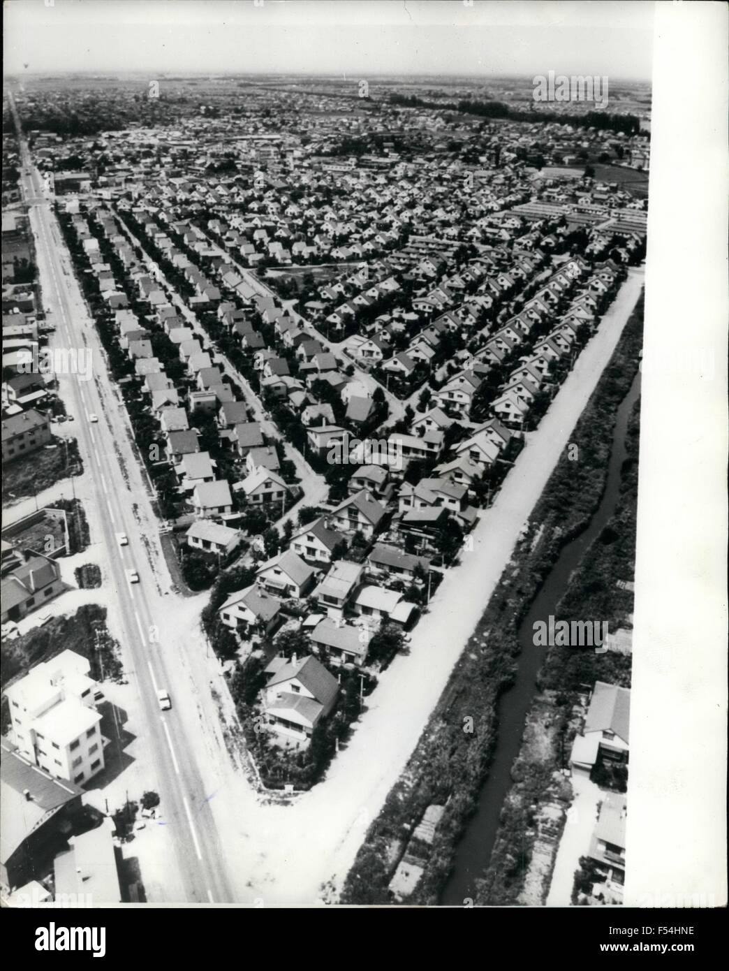 1968 - No fear of being Lonely here: Japan with a population of 112 million, and still growing, plus the skyrocketing price of land, results in new housing complexes being squeezed together like sardines in a tin, Even in the nothernmost island of Hokkaido. where land is more obtainable than in other regions of the country, builders still find difficulties in finding suitable sites near cities and towns for the convenience of commuters. Photo shows A wedge shaped suburban residential complex in Okadama, on the outskirts of Sapporo, Hokkaido's principal city, showing hundreds of houses crammed Stock Photo