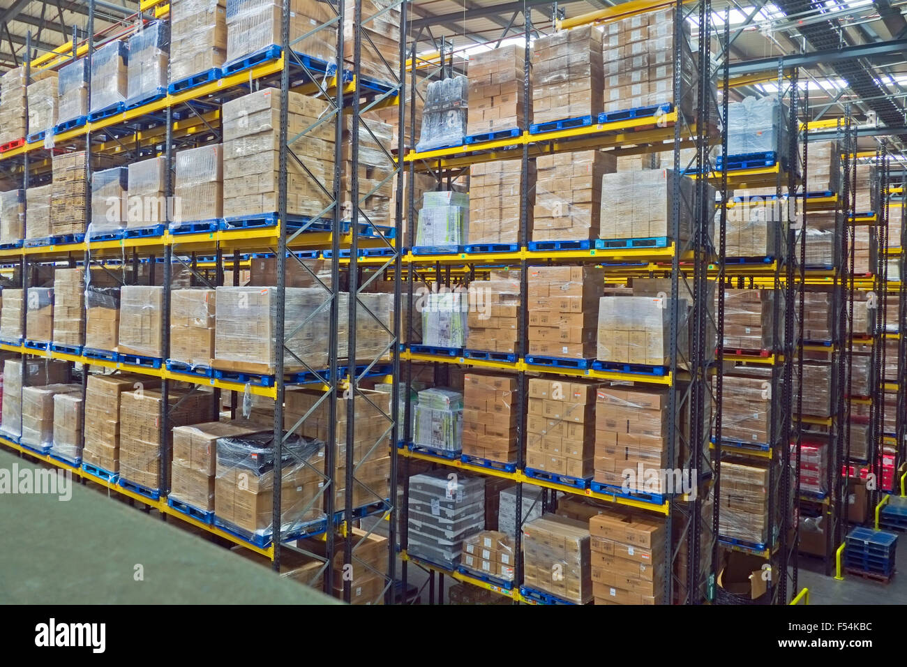 Lines of stacked pallets in warehouse UK Stock Photo