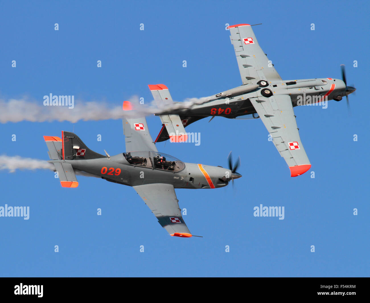 PZL-130 Orlik propeller powered trainer planes of the Polish Air Force flying in formation during an air display. Military aviation. Stock Photo