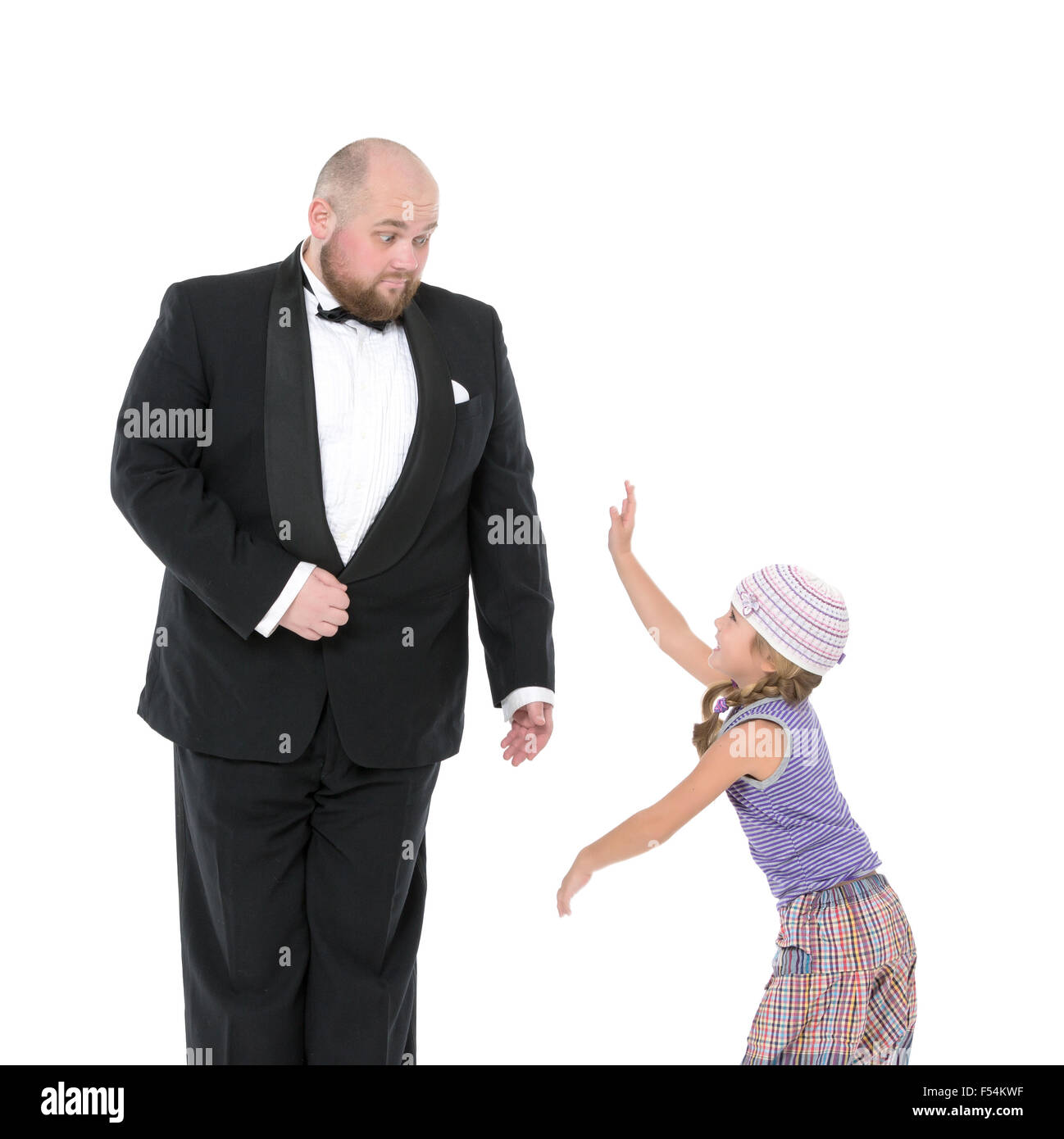 Little Girl and Servant in Tuxedo Have Fun, on white background Stock Photo