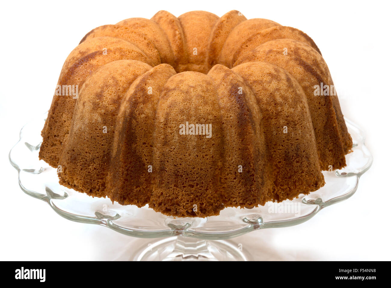Pound cake on cake plate.  Isolated on white background. Stock Photo