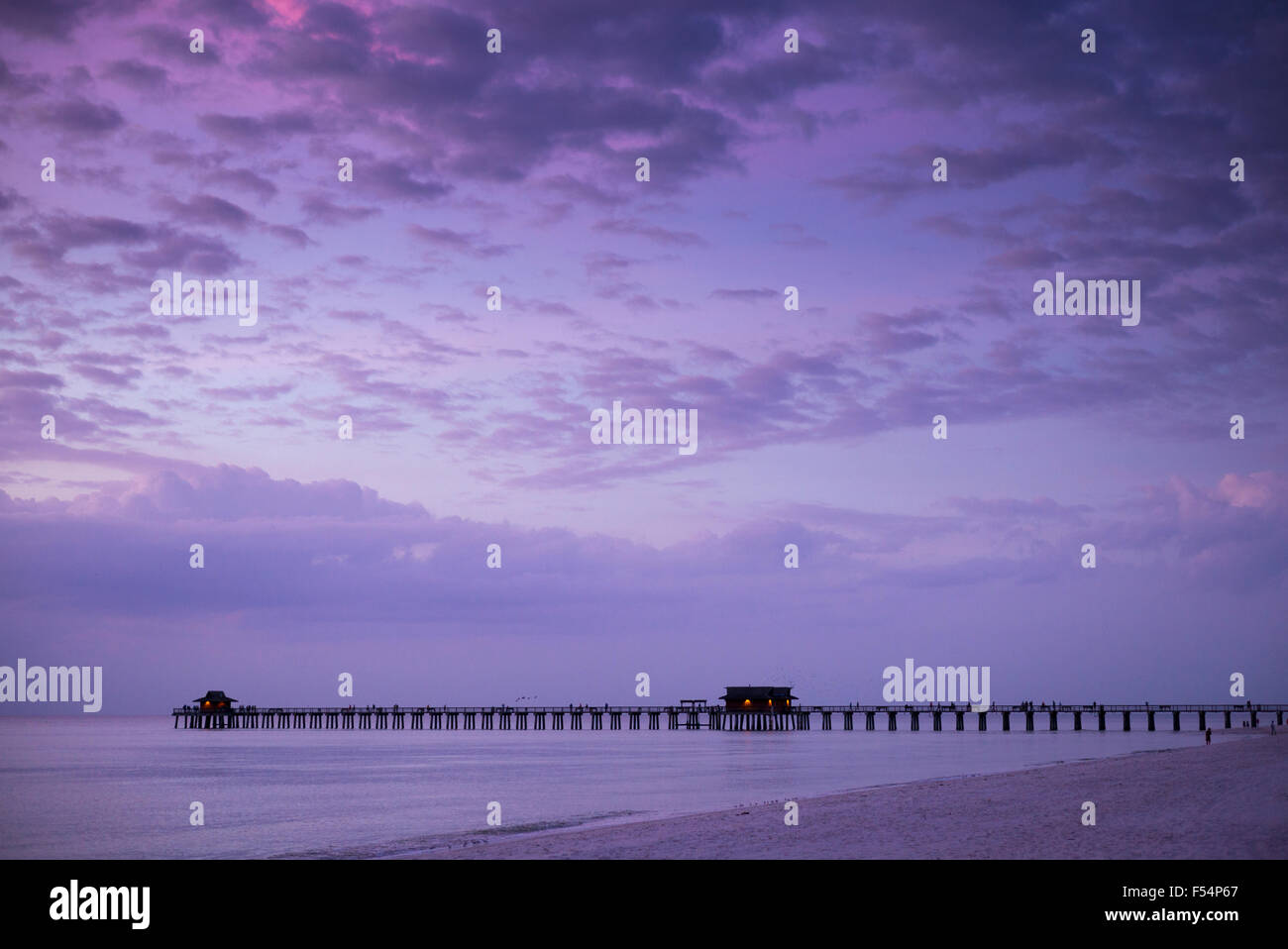 The pier at Naples beach at sunset in Florida, United States of America Stock Photo