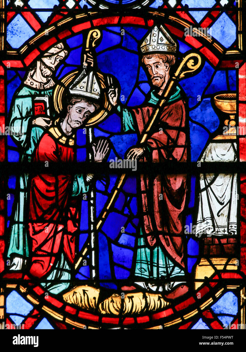 Stained glass window depicting three Bishops in the Cathedral of Tours, France. Stock Photo
