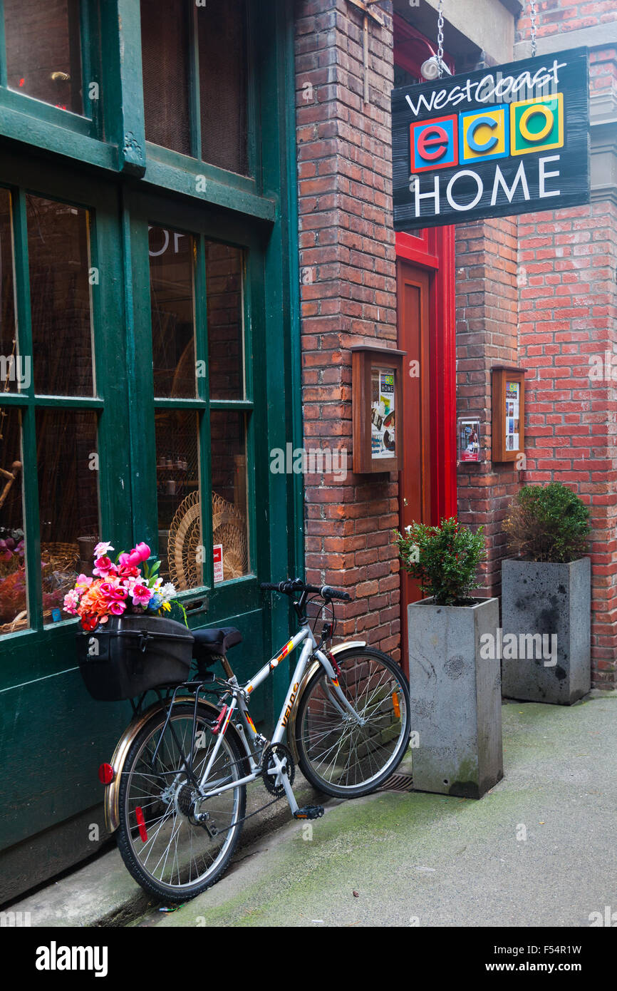 Bicycle with flowers parked in Fan Tan Alley, Chinatown, Victoria, British Columbia Stock Photo