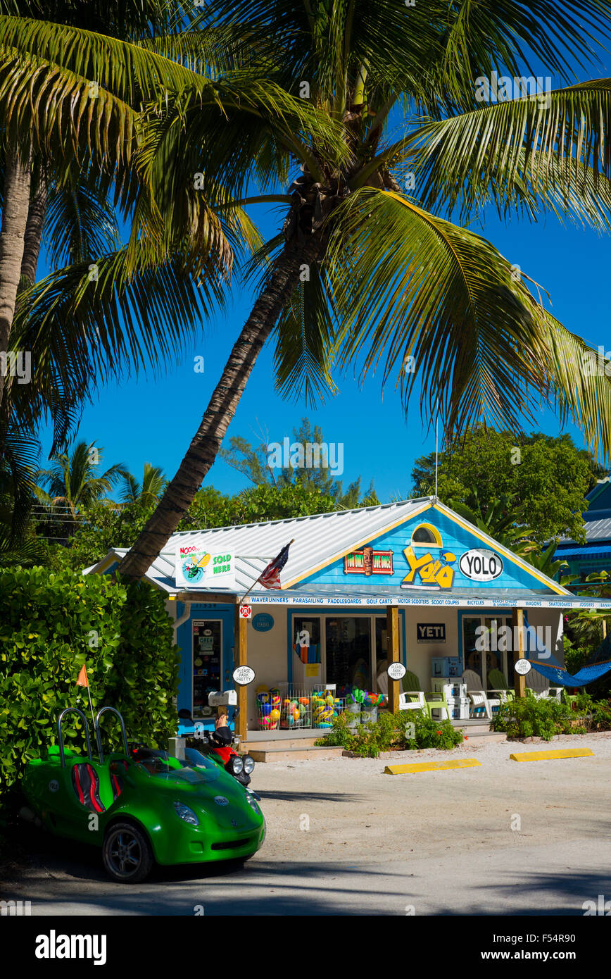 Souvenir and watersports equipment shop Yolo and palm trees in downtown Captiva Island in Florida, USA Stock Photo