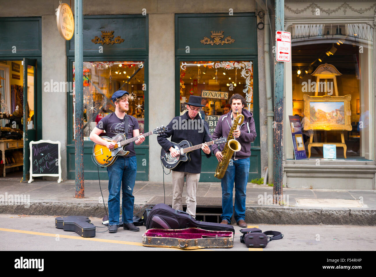 Jazz musicians saxophonist and guitarist in live busking performance on