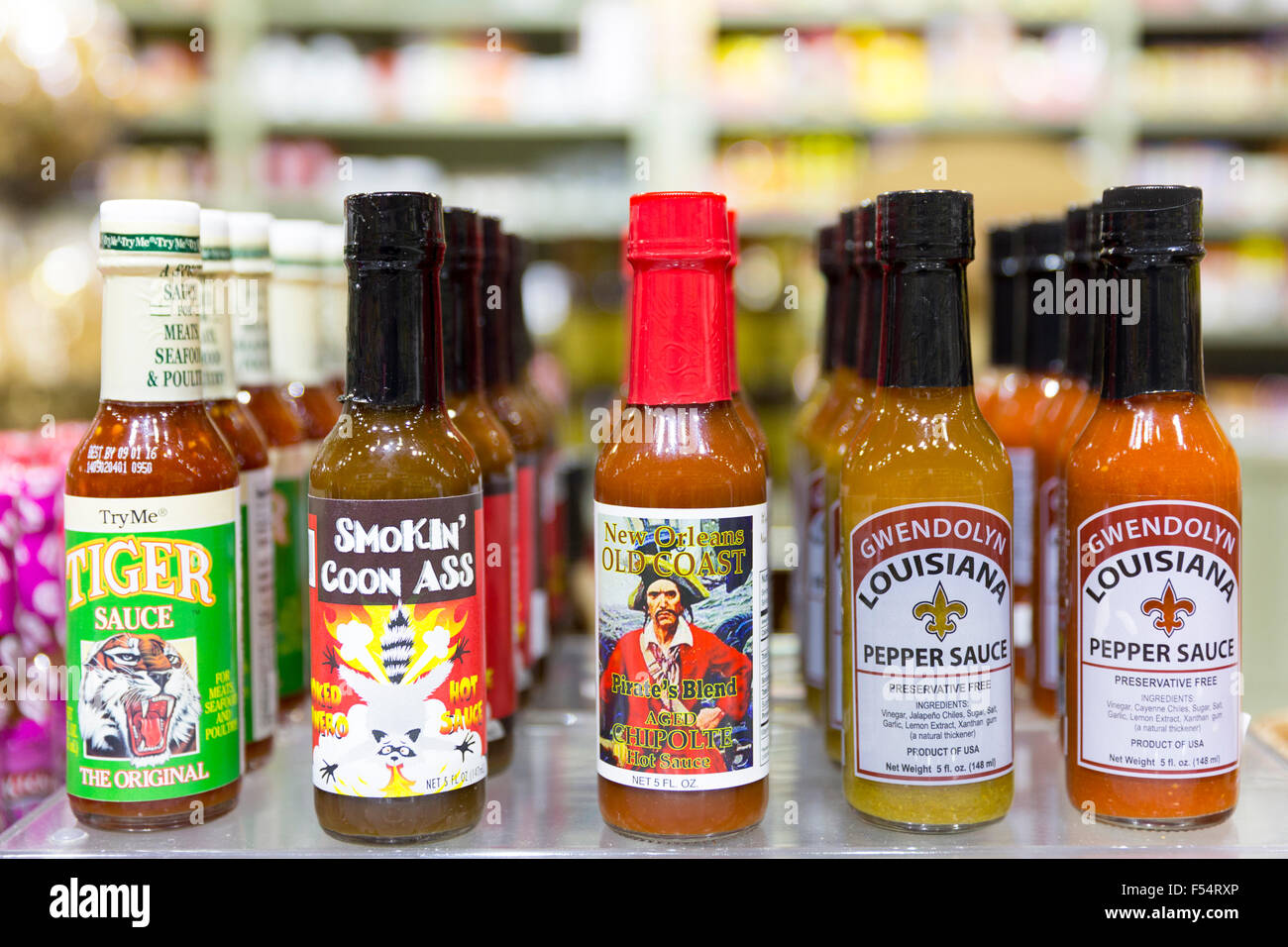 Bottles of Cajun spicy sauces Chipolte, Pepper at Magnolia Sugar