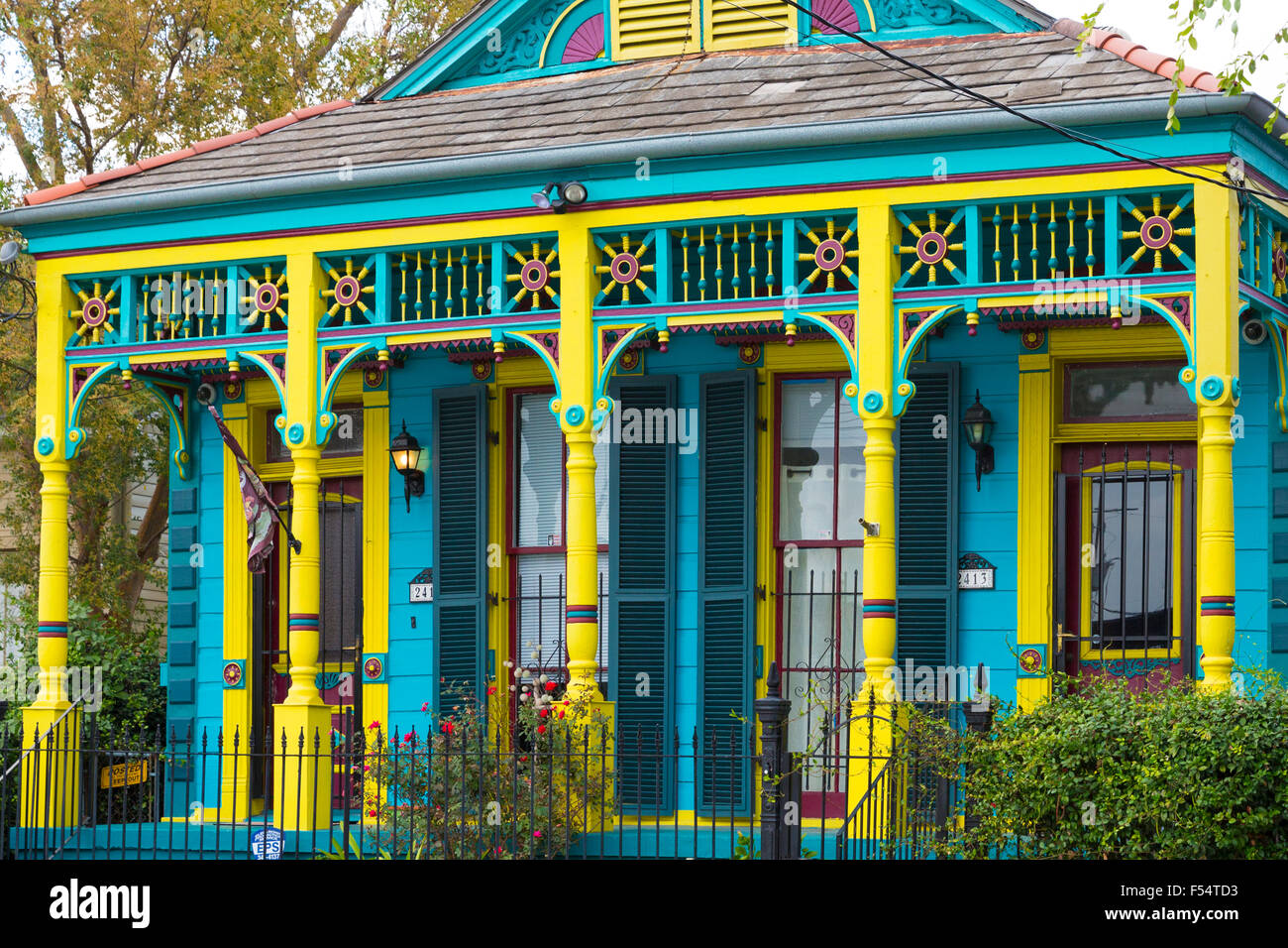 Traditional bright colour clapboard creole cottage home in Faubourg