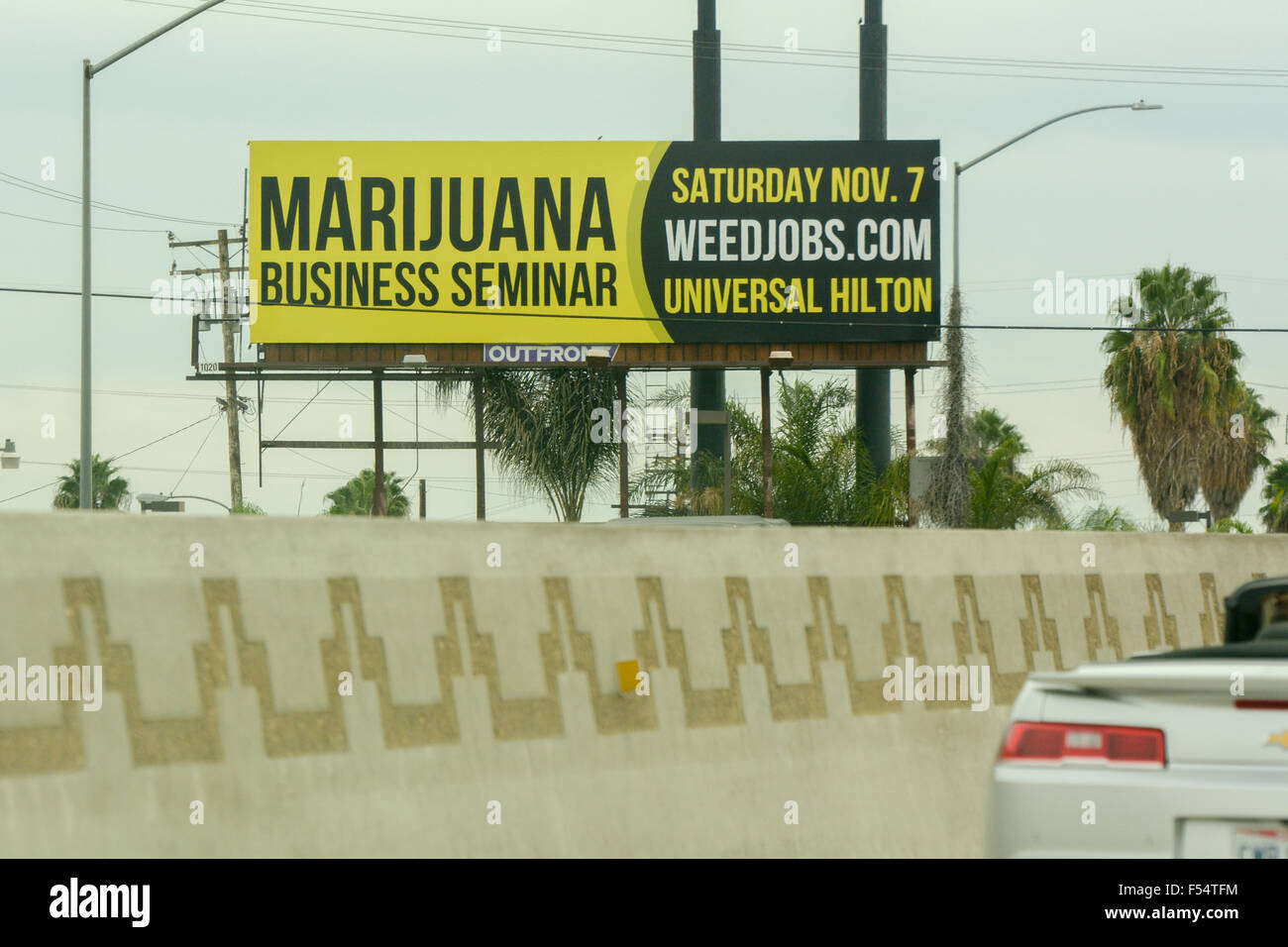 Road sign for Marijuana Business Seminar on the 101 Freeway in