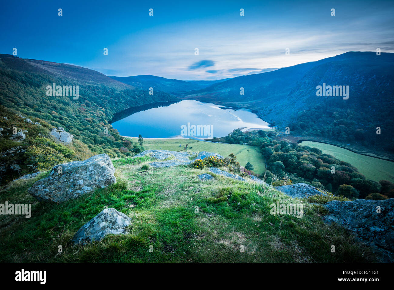View of Lough Tay (Guinness Lake) and Luggala in the Wicklow Mountains, Ireland at nightfall Stock Photo