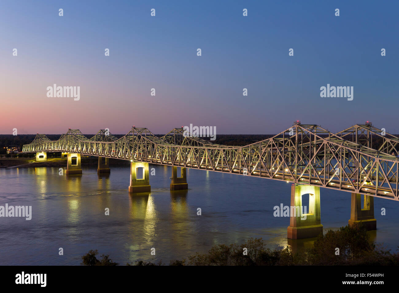 Nighttime scene illuminated iron cantilever Natchez Vidalia Bridge