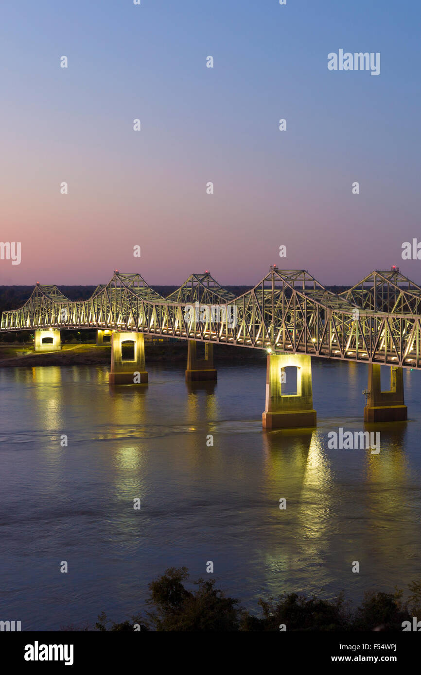 Nighttime scene illuminated iron cantilever Natchez Vidalia Bridge