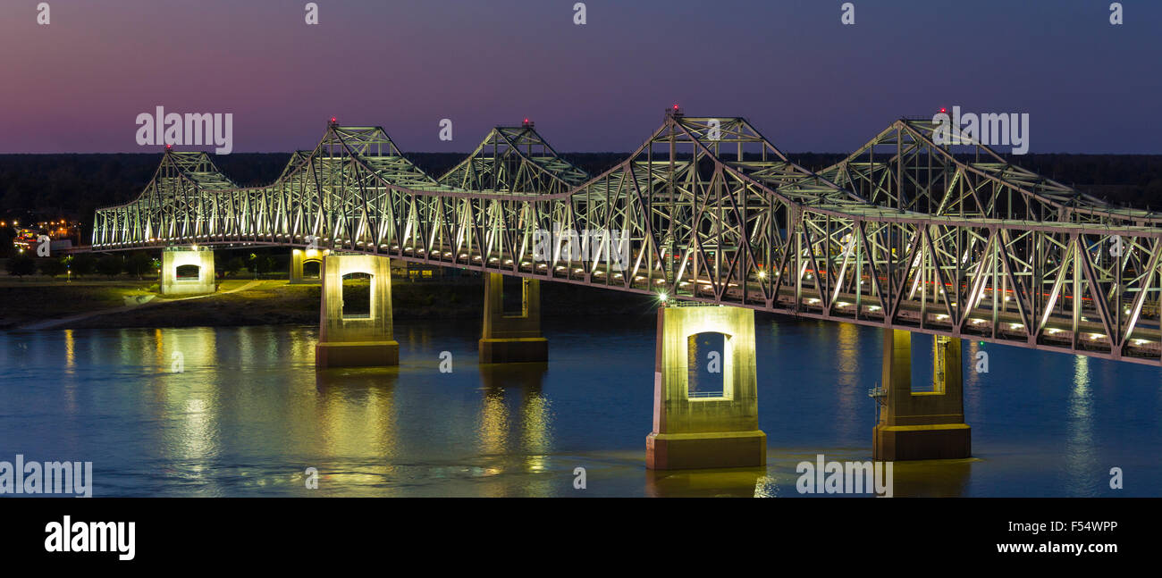 Nighttime scene illuminated iron cantilever Natchez Vidalia Bridge