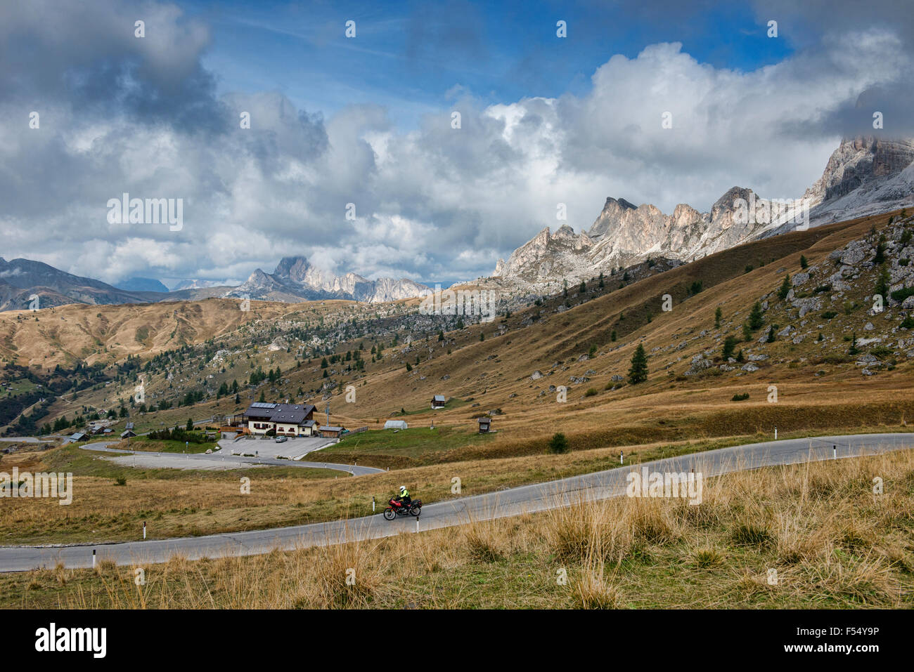 Motorcylist crossing the Passo Giau in the Dolomites, Belluno, Italy Stock Photo