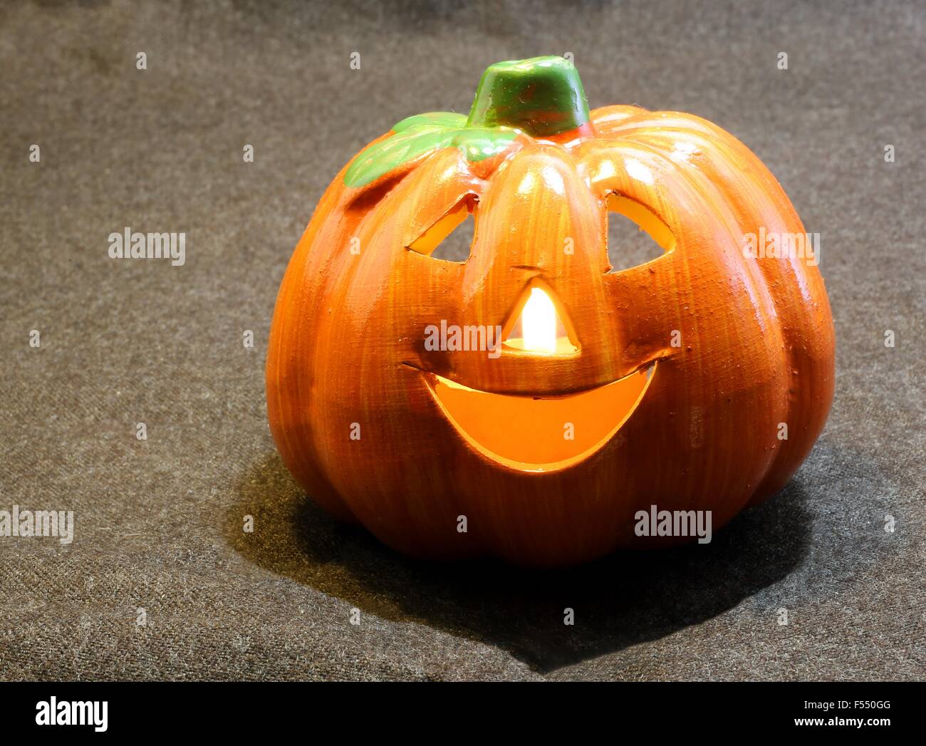 Orange jack o lantern symbols of Halloween with candle Stock Photo Alamy