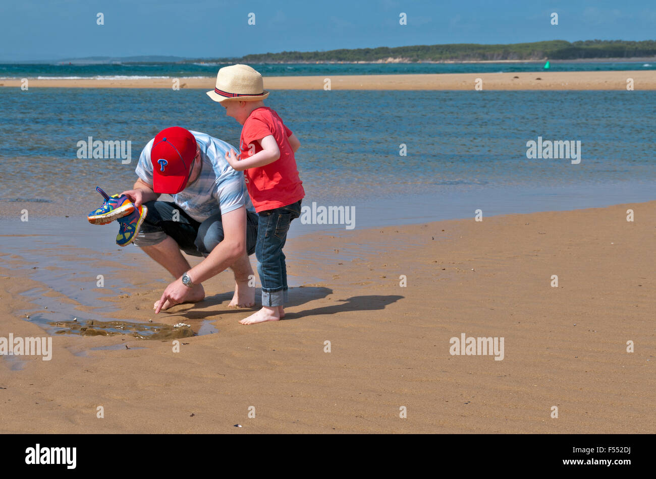 Searching for sea creatures on the beach Anderson Inlet Inverloch ...