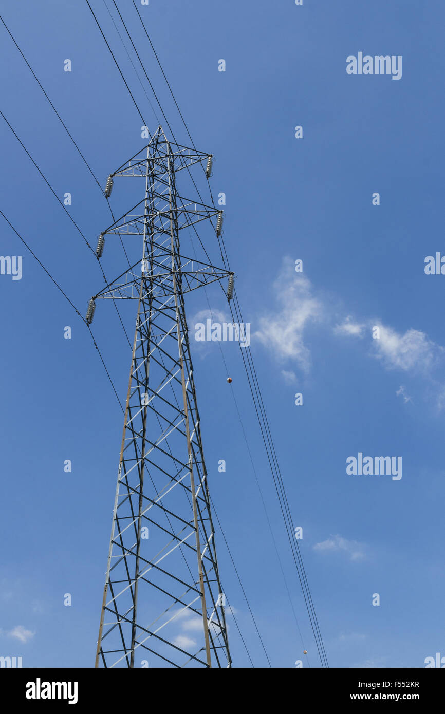 Pylon with blue sky and clouds in the background Stock Photo - Alamy