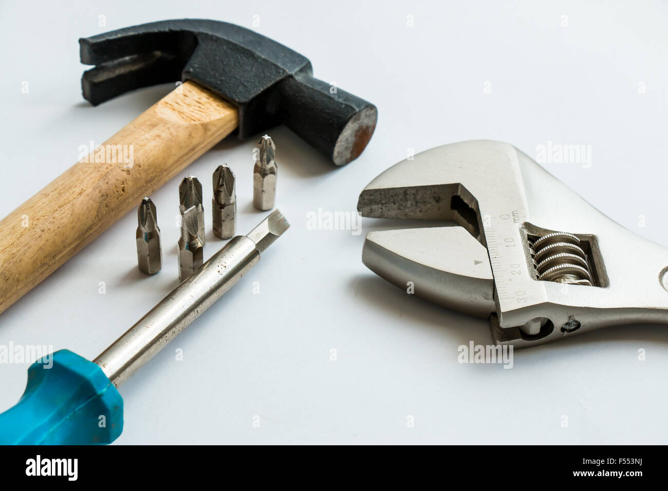 Hammer, Screwdriver, and Spanner on the white background Stock Photo