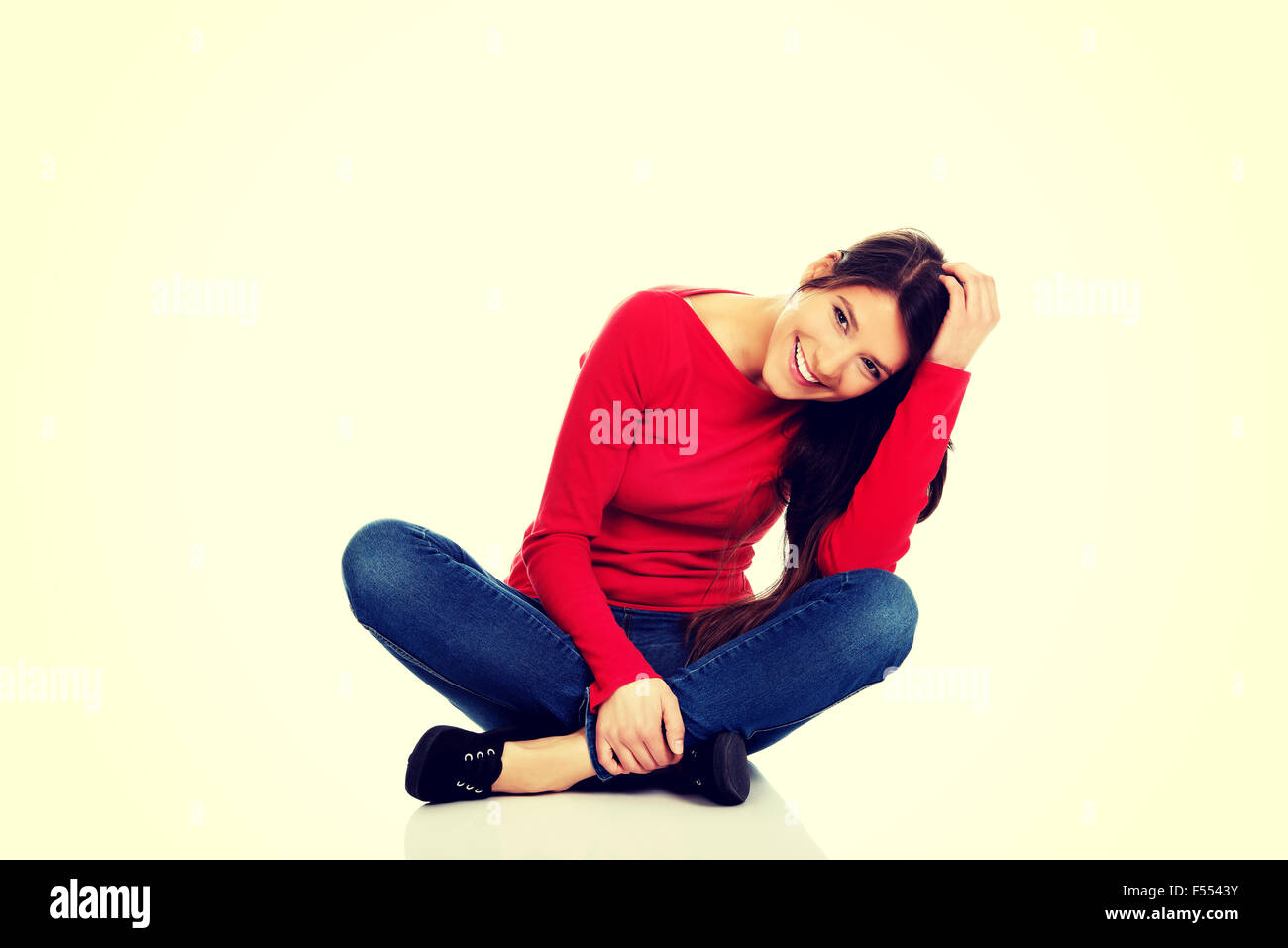 Woman sitting cross legged on the floor Stock Photo Alamy