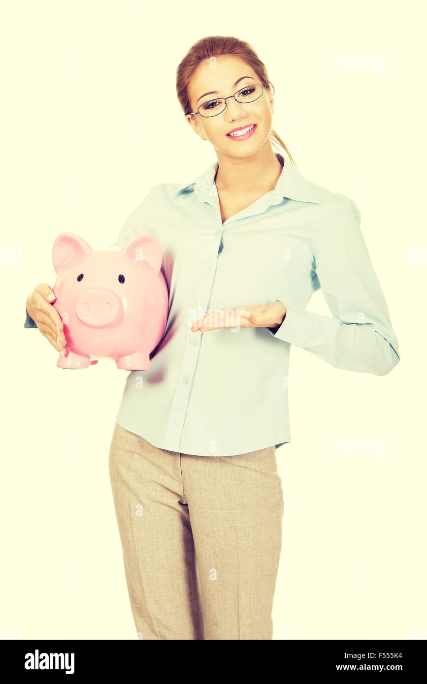 Woman holding piggy bank Stock Photo - Alamy
