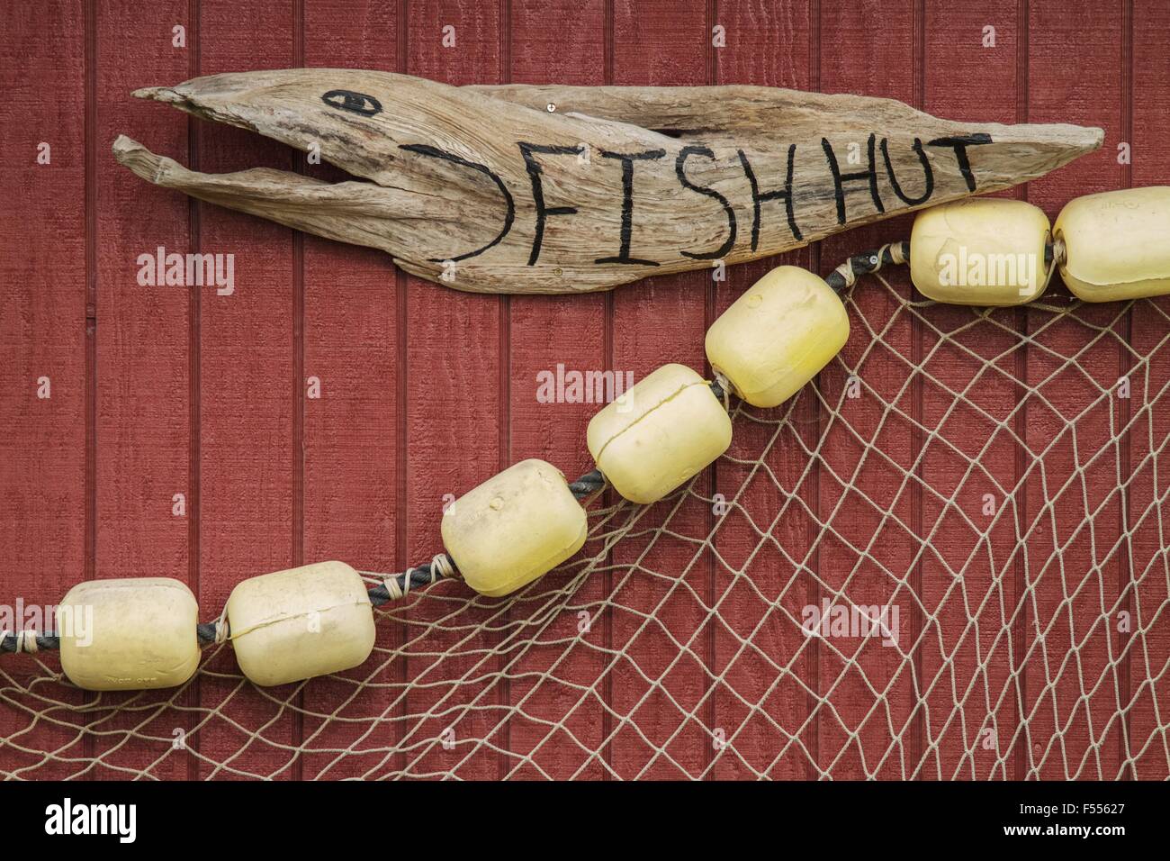 Sign on house of fisherman with net Stock Photo - Alamy