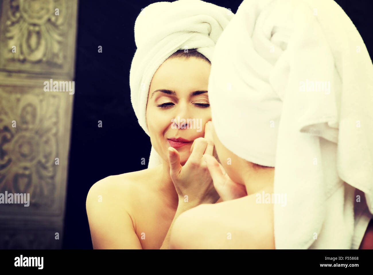 Woman squeeze her acne. Stock Photo