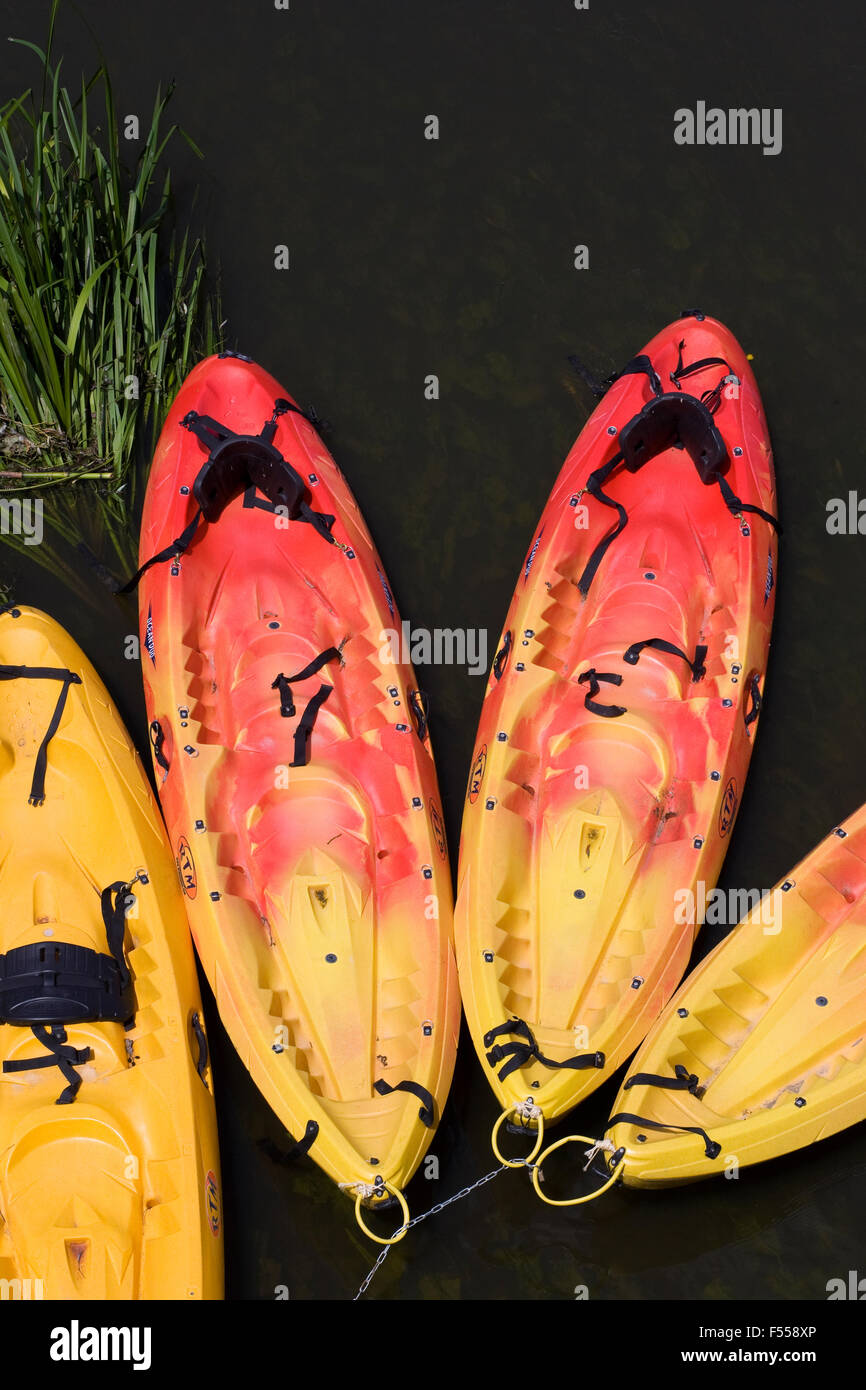 Colourful kayaks on the river. Stock Photo