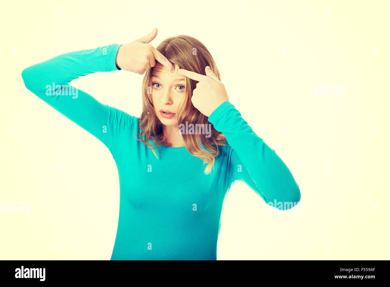 Young woman squeezing pimple Stock Photo