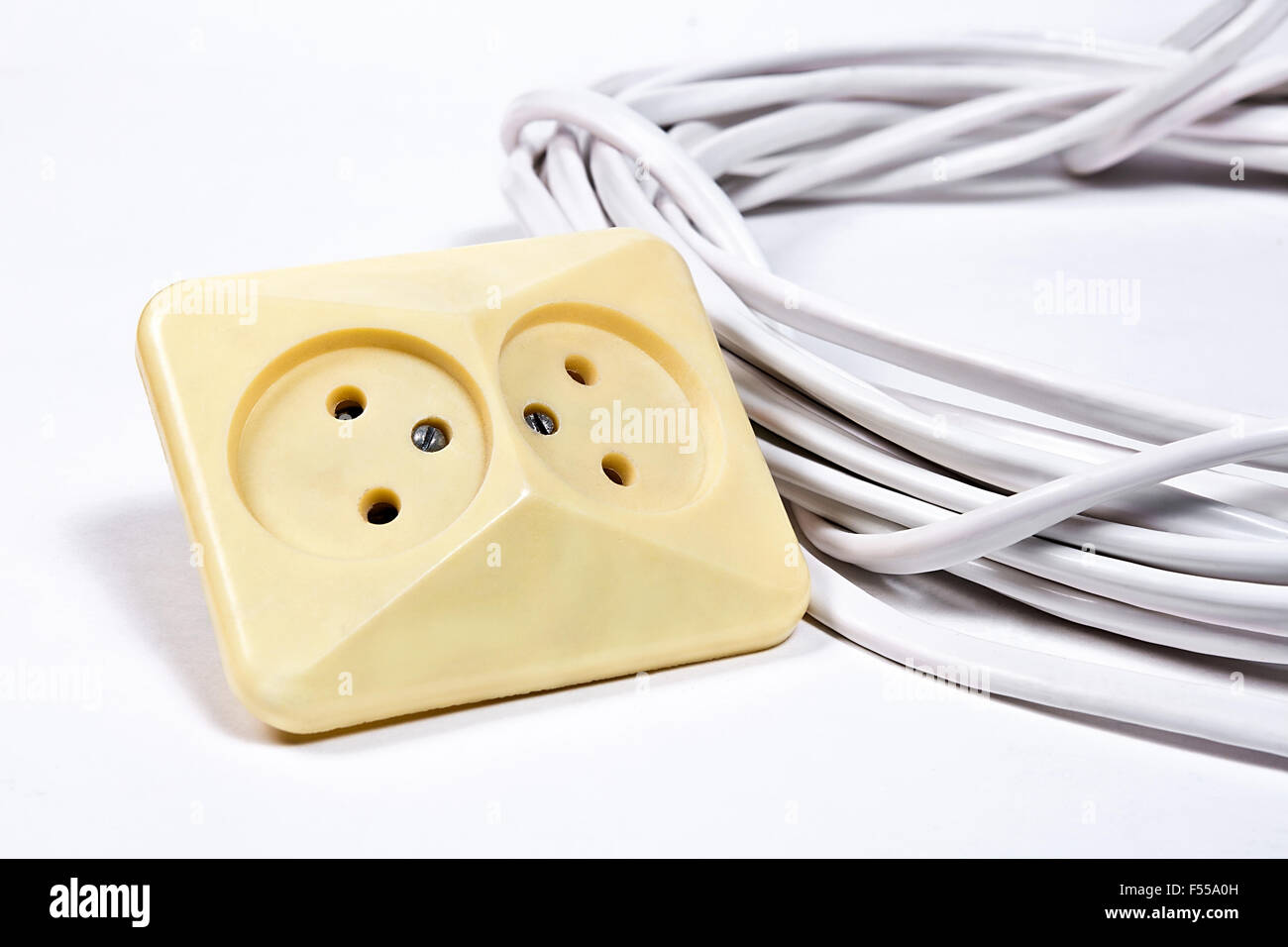 Wall sockets and power cable on white background Stock Photo Alamy