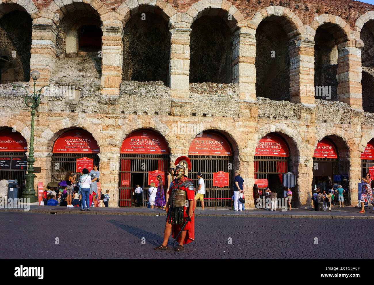 Man posing as a roman gladiator extra in front of the Roman Amphitheatre at Verona, Veneto, Italy Stock Photo