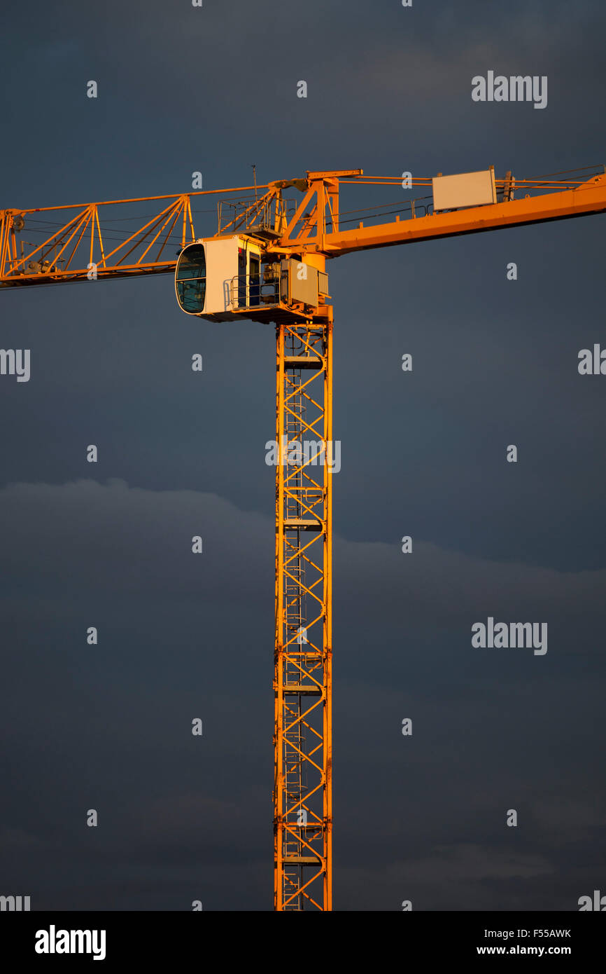 Low angle view of crane against sky at dusk Stock Photo