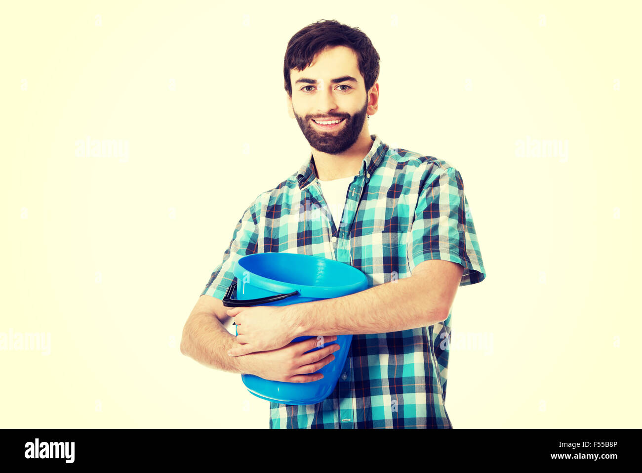 Handsome man holding plastic bucket. Stock Photo