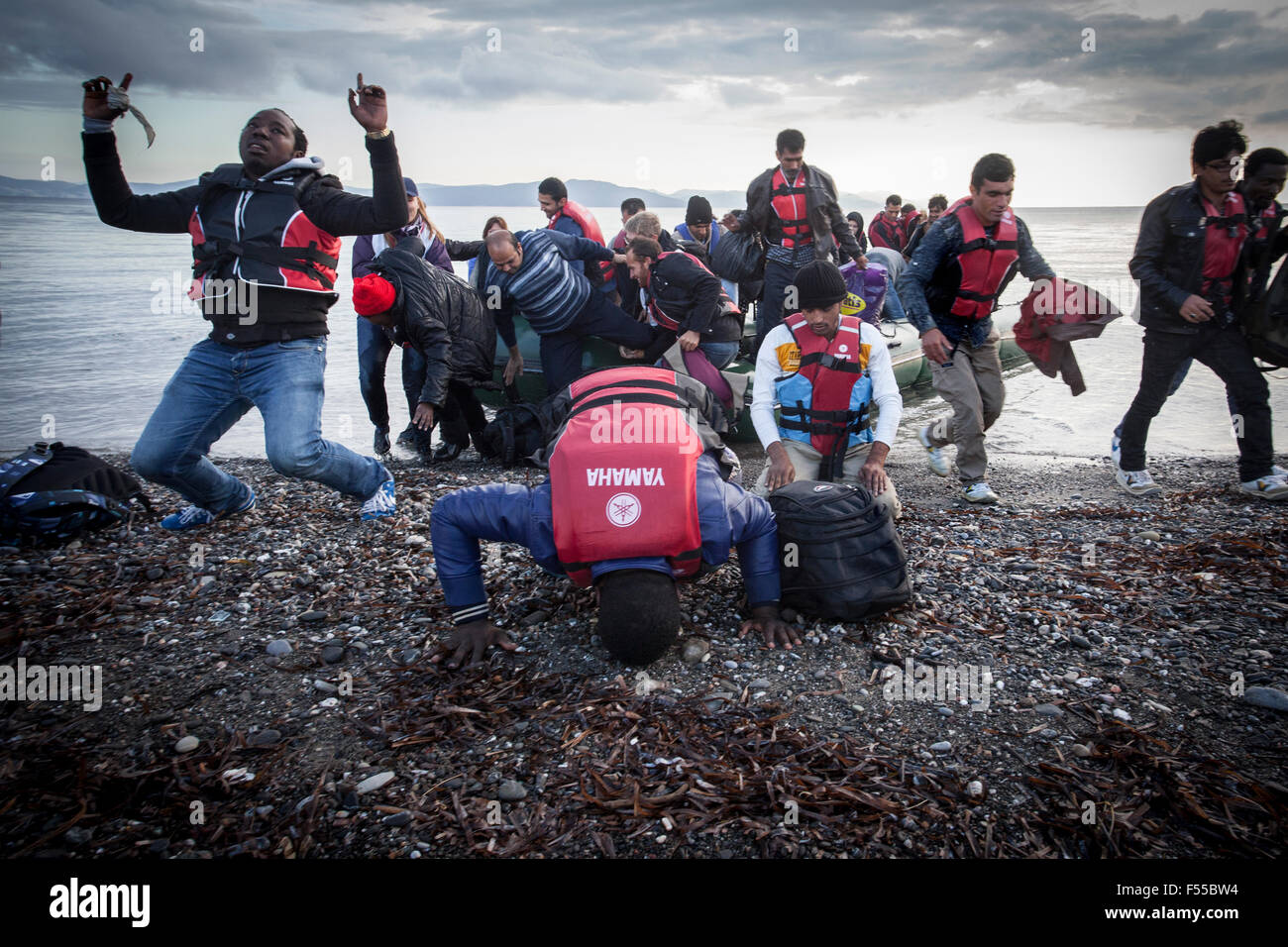 It's a joy and a great relief to be able to tread the European land. For many refugees this is the end of the war. Stock Photo