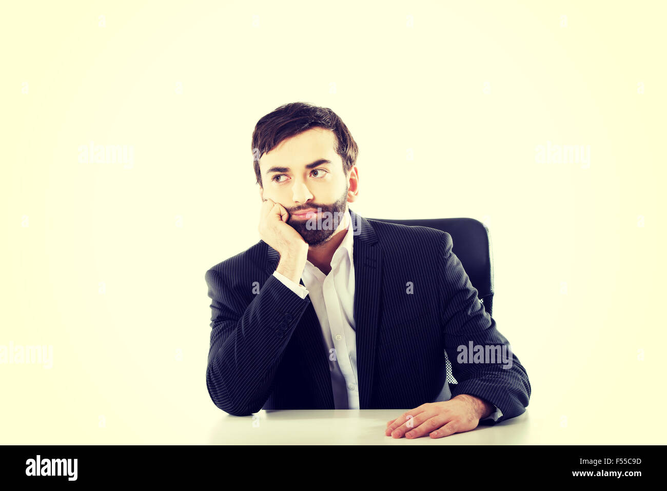Businessman sitting at the desk Stock Photo - Alamy