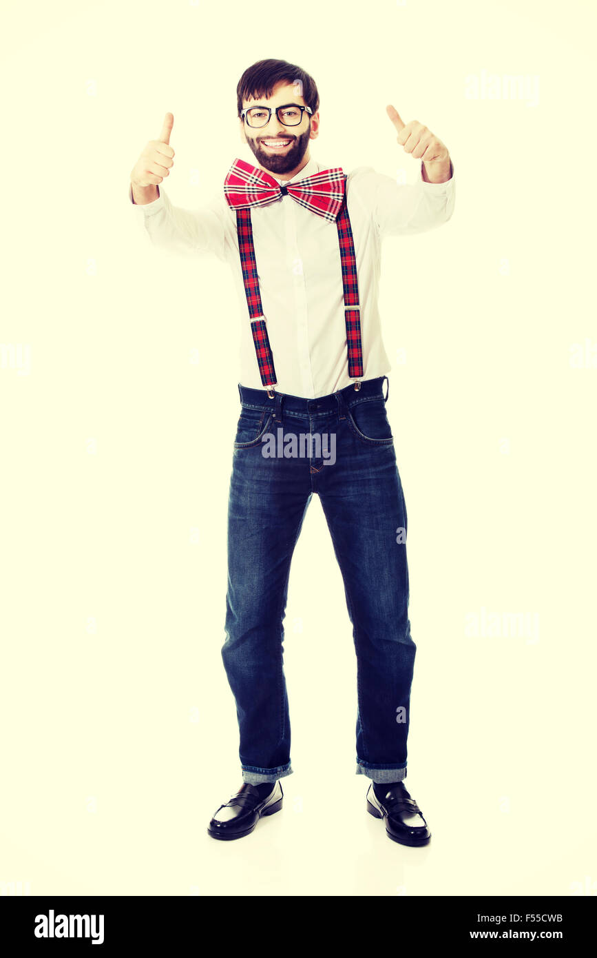 Man wearing suspenders with thumbs up. Stock Photo
