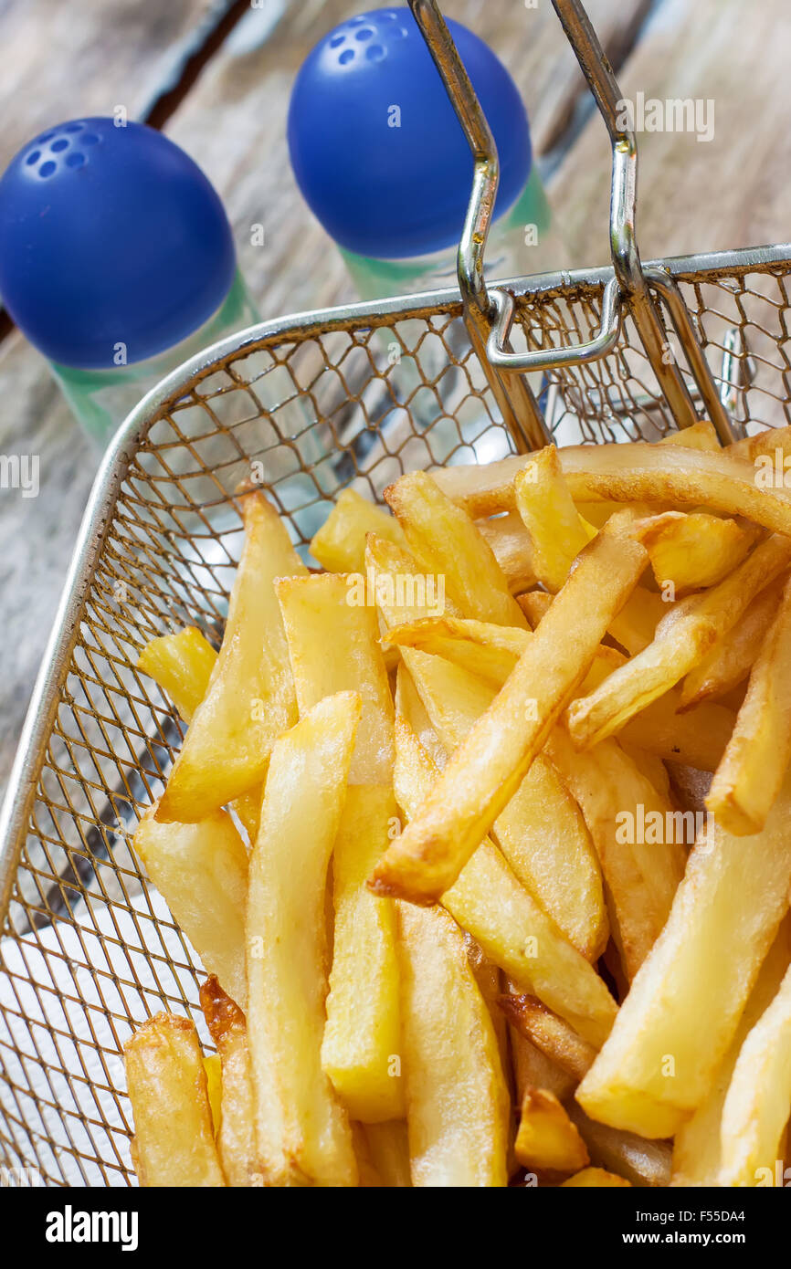 french fries in metalic deep frier basket Stock Photo Alamy