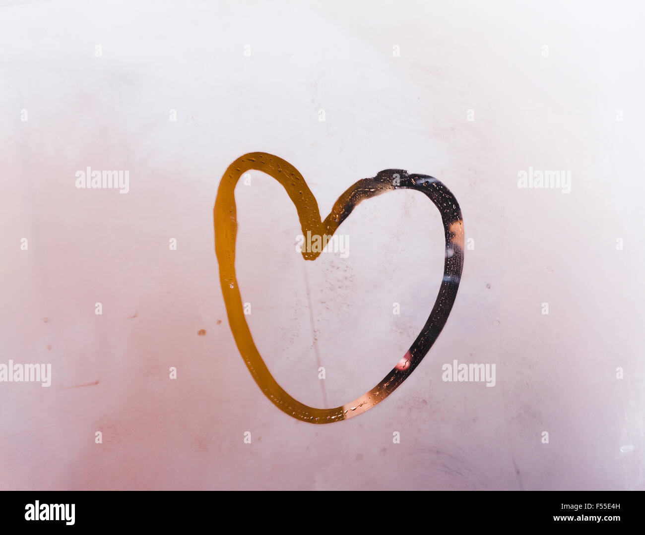 The drawn heart, the morning message, on glass in a bathroom Stock Photo