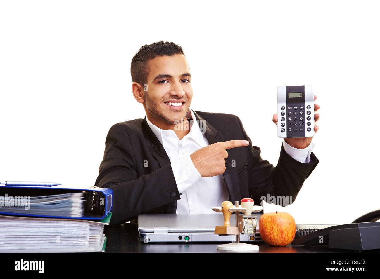 Manager Using Calculator Young manager at his desk showing a calculator Stock Photo - Alamy