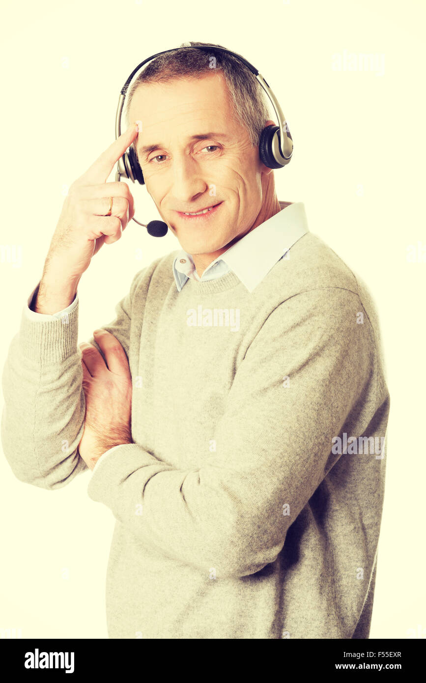 Old call center man wearing headset Stock Photo