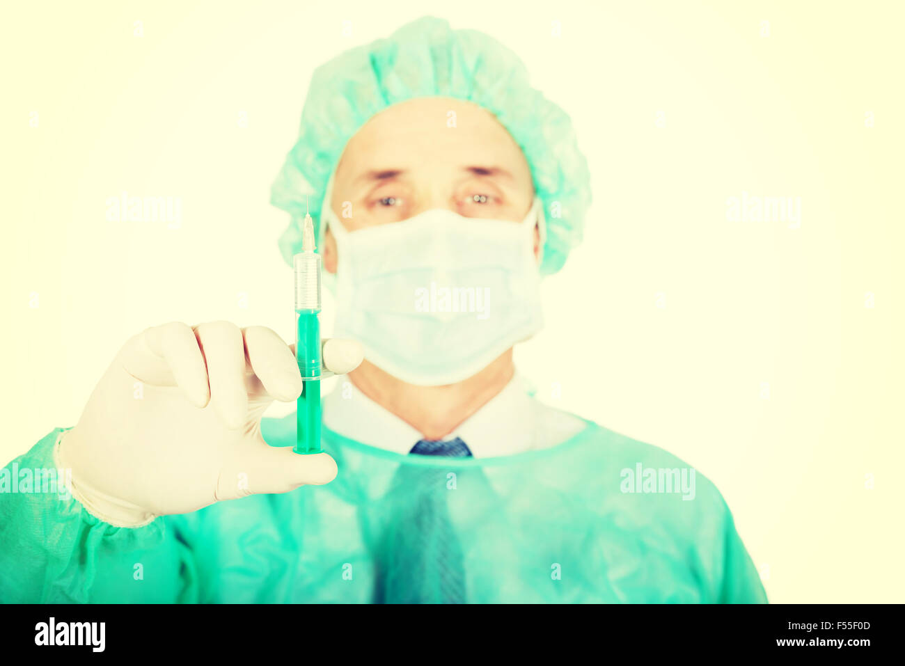 Male doctor holding a syringe Stock Photo