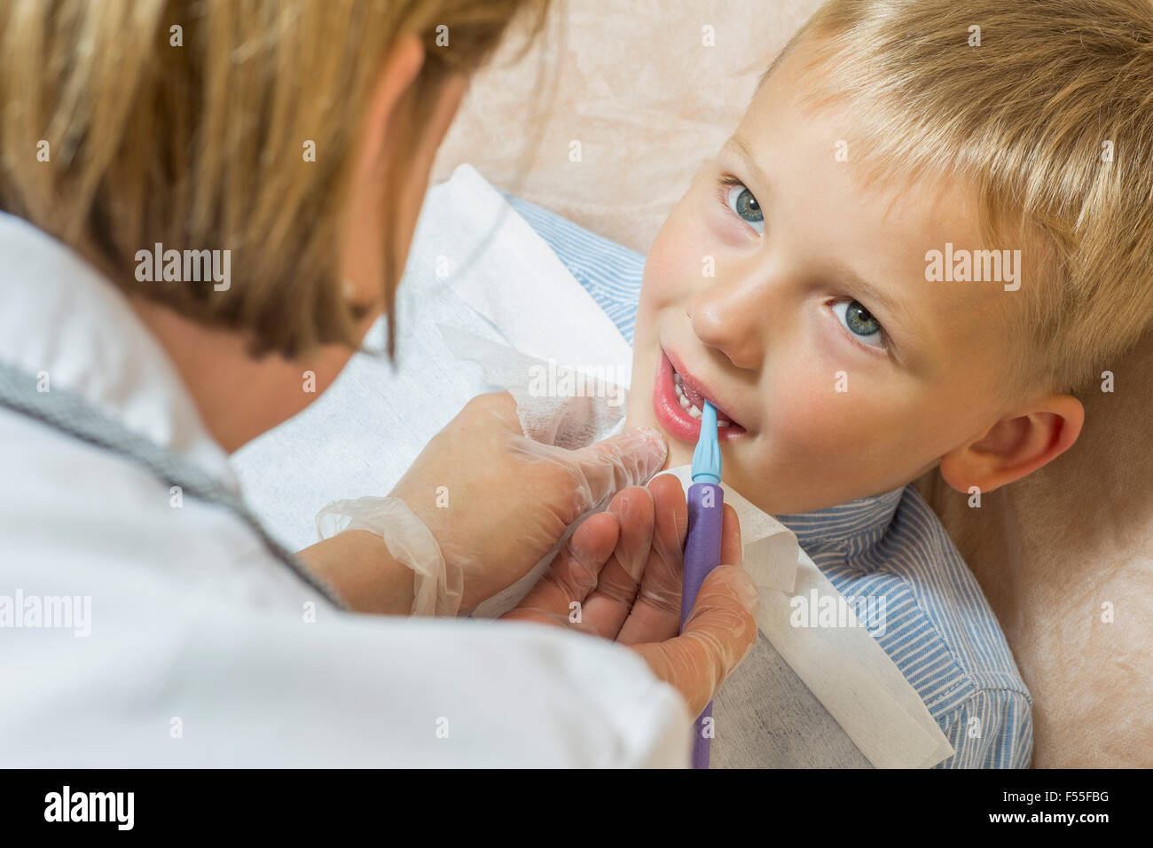 High angle view of speech therapist treating a boy Stock Photo