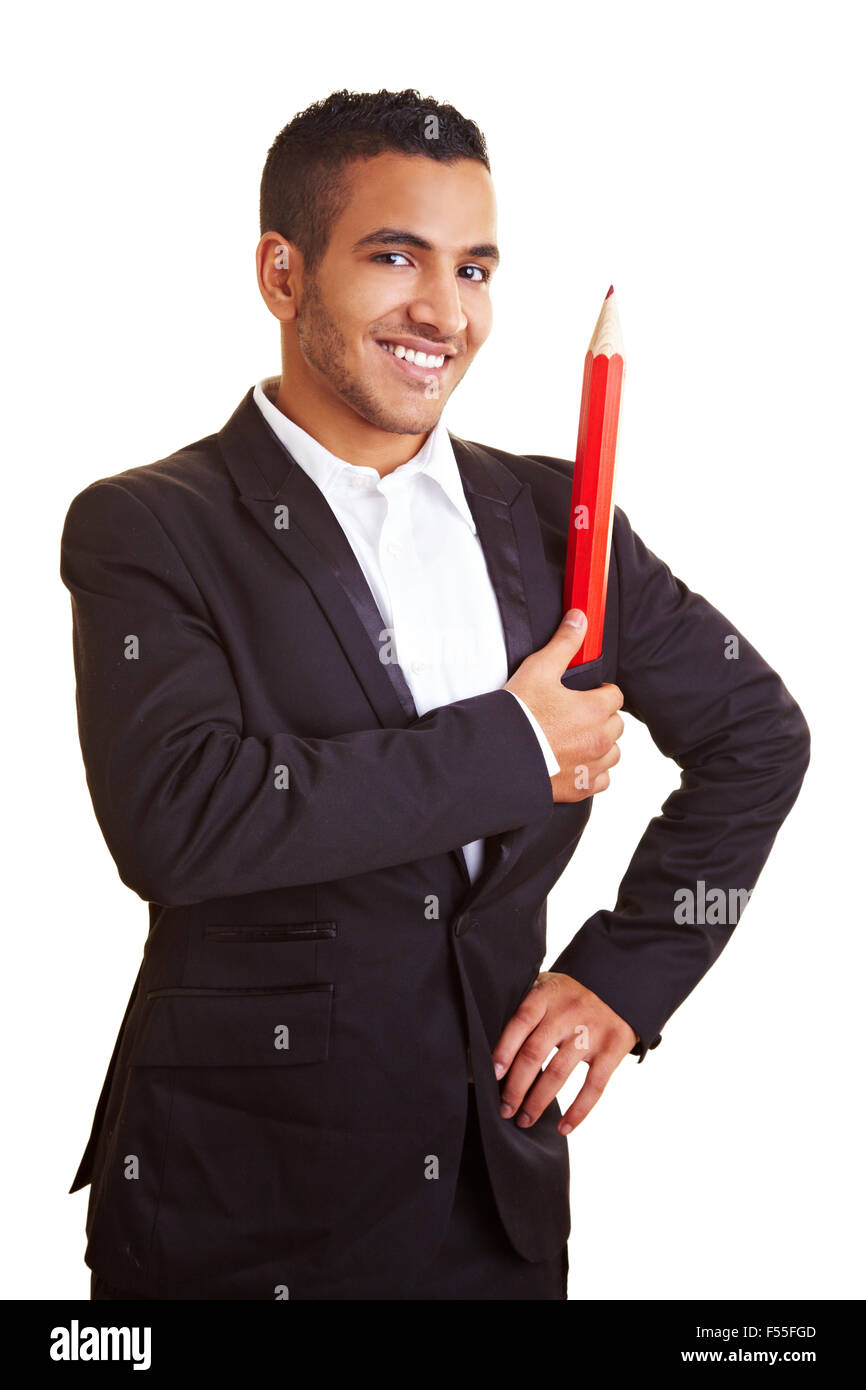 Young businessman holding an oversized red pencil Stock Photo