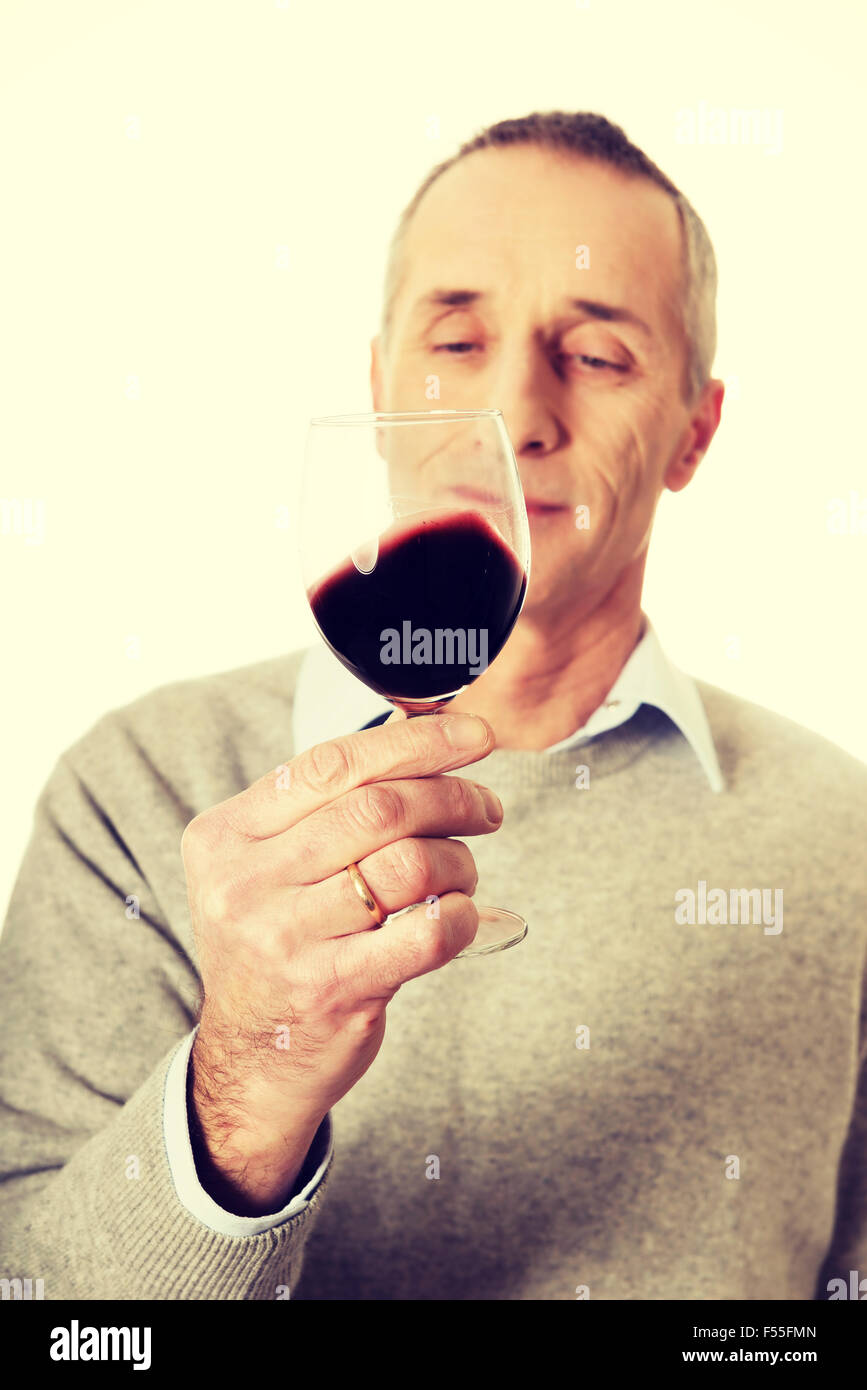 Mature man tasting red wine Stock Photo Alamy
