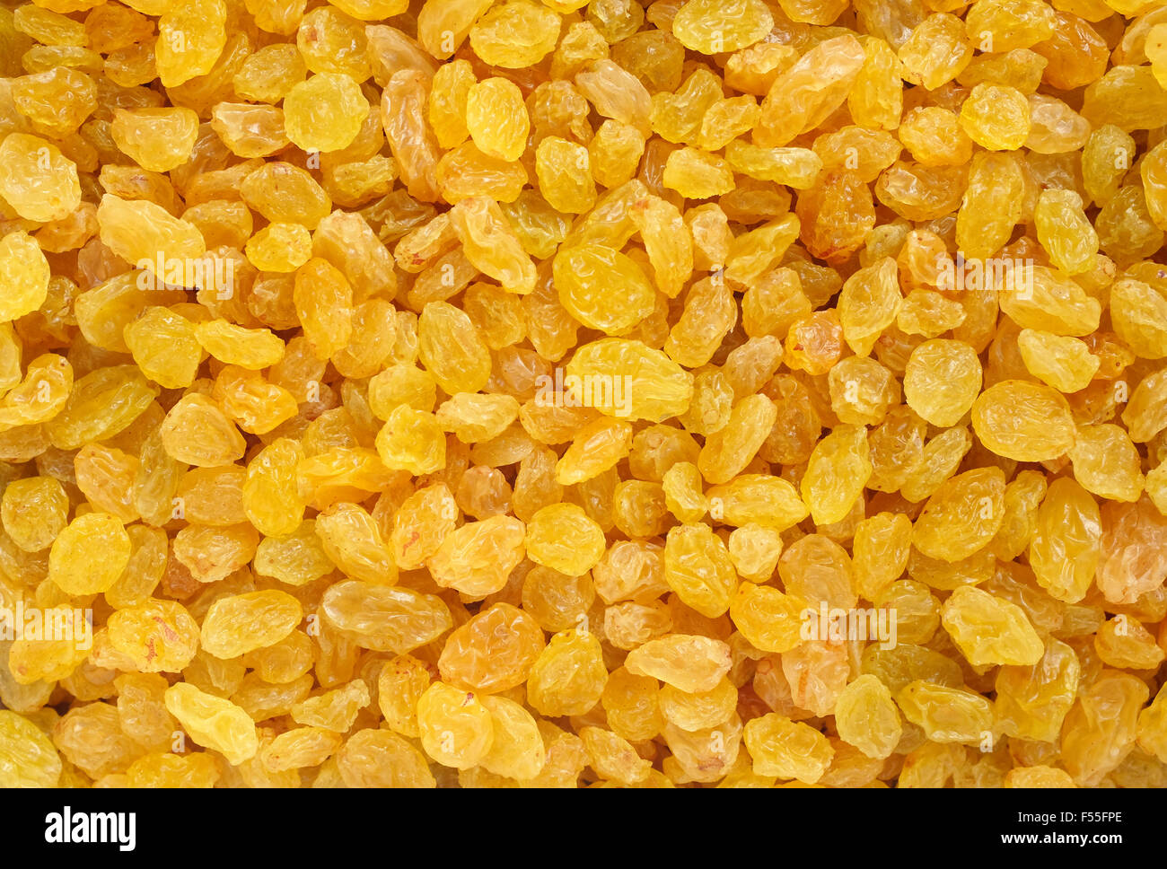 Golden raisins as an abstract background texture Stock Photo Alamy
