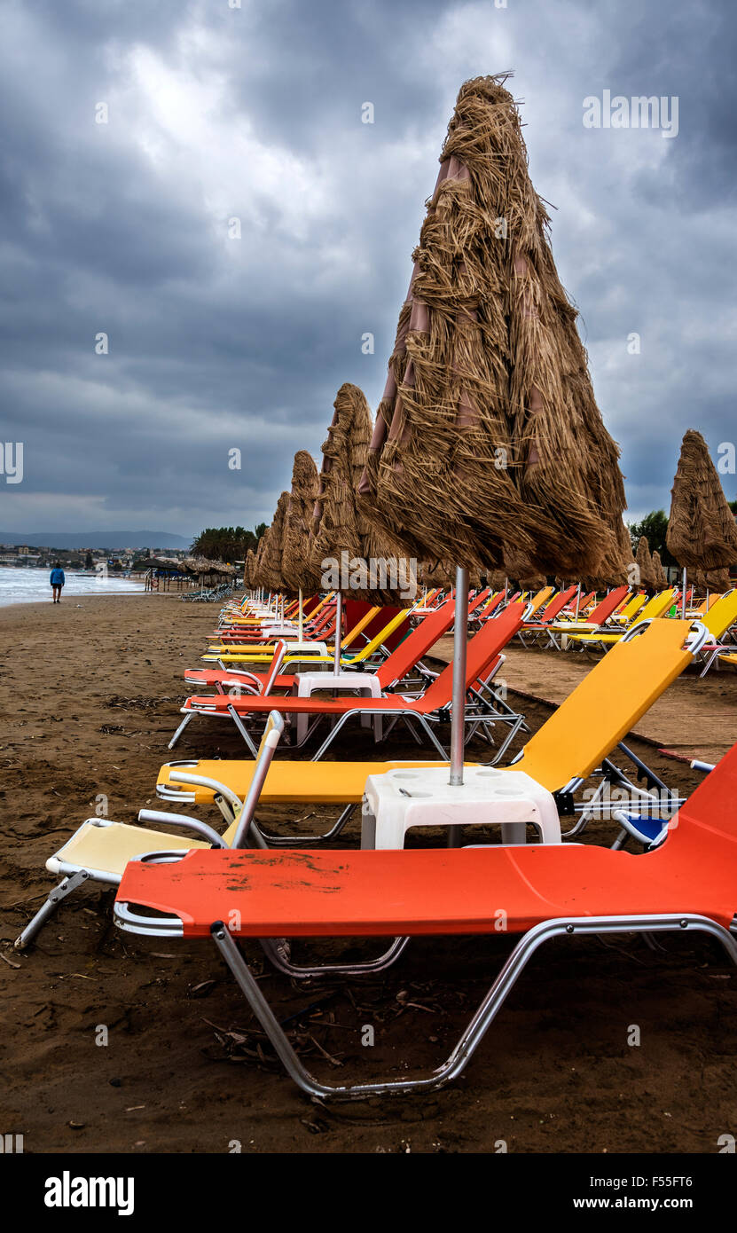Sun beds on a cloudy day at Agia Marina Beach, Chania. Stock Photo