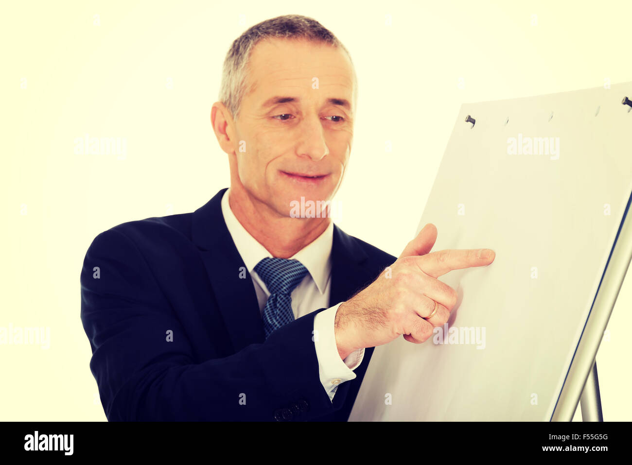 Male executive presenting on flip chart Stock Photo
