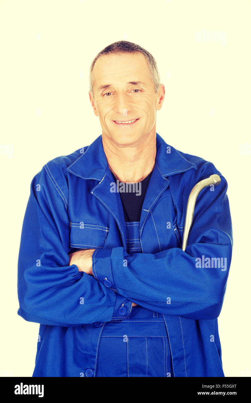 Repairman holding wrench Stock Photo Alamy