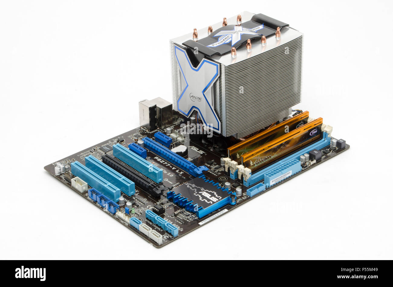 ASUS motherboard (P8Z77-V LX) with Arctic Cooler Freezer Xtreme CPU cooler Team Vulcan DDR3 memory sticks in situ. Stock Photo